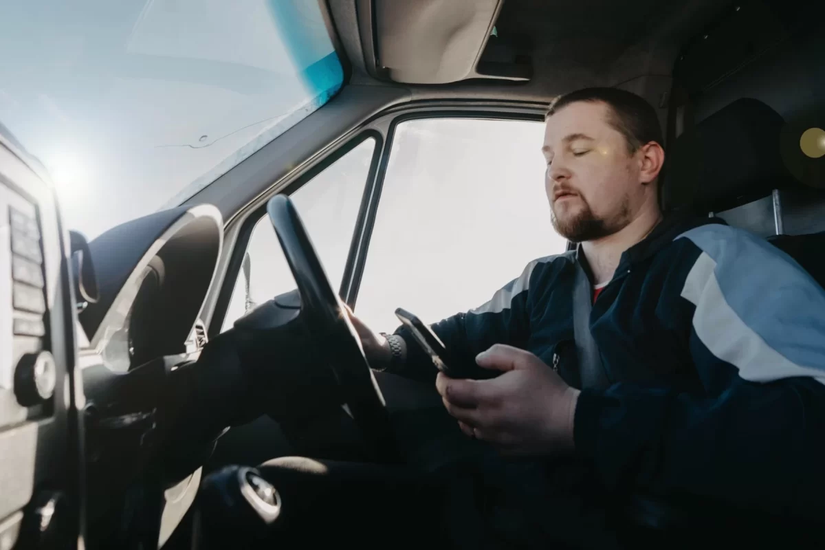 Distracted truck driver using mobile phone while driving